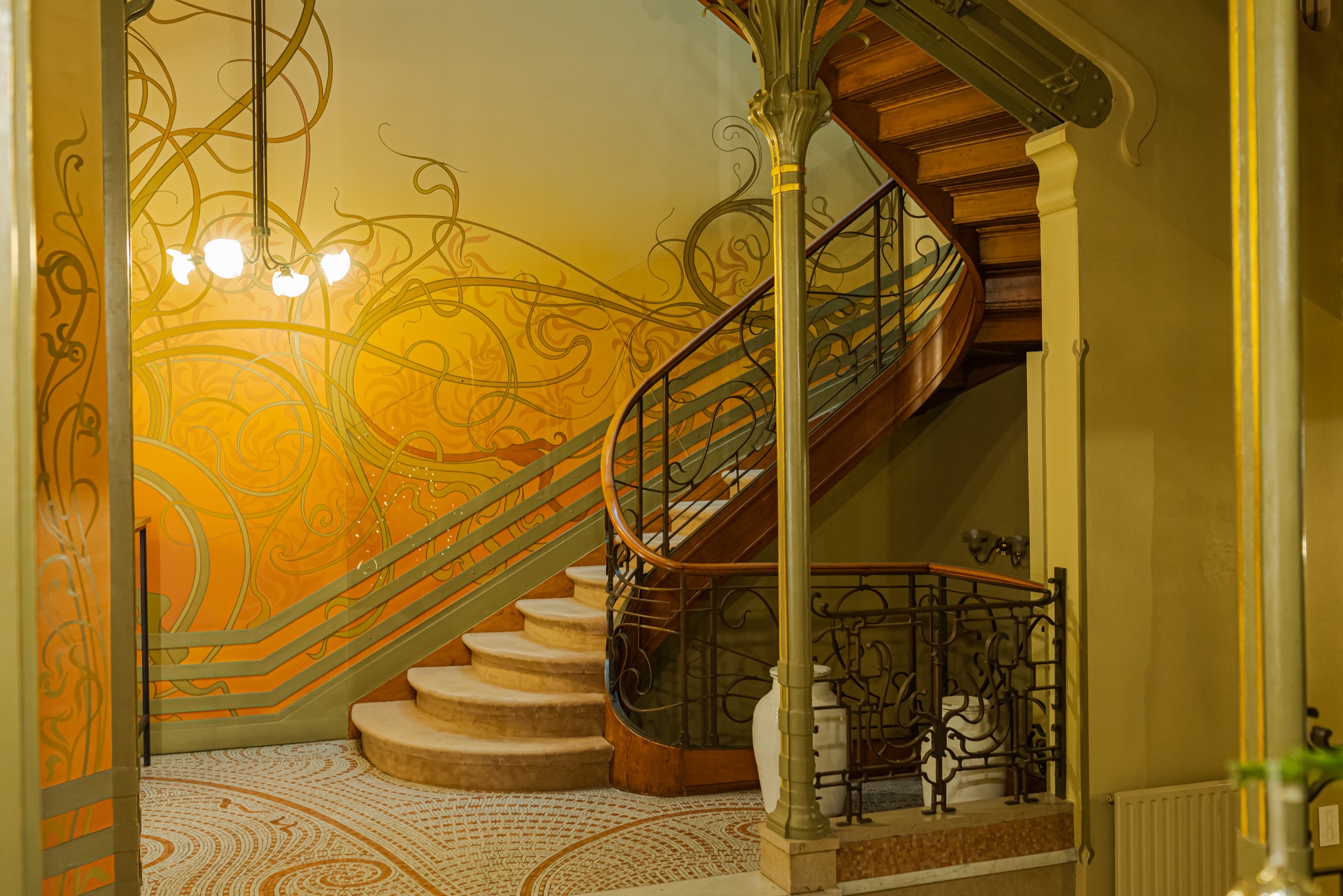 Painted vines and winding staircase of the Hôtel Tassel by Victor Horta, Brussels